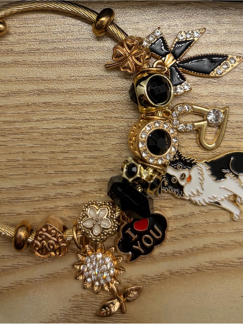 Gold-Tone Black & White Charm Bracelet with Floral and Dog Charms